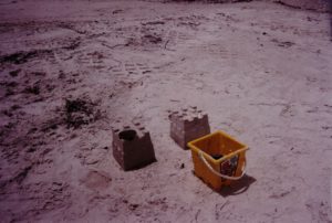 Using my pail to make sand castles.